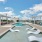 resort style pool with lounge chairs in the water